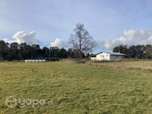 Se vende terreno con cabaña