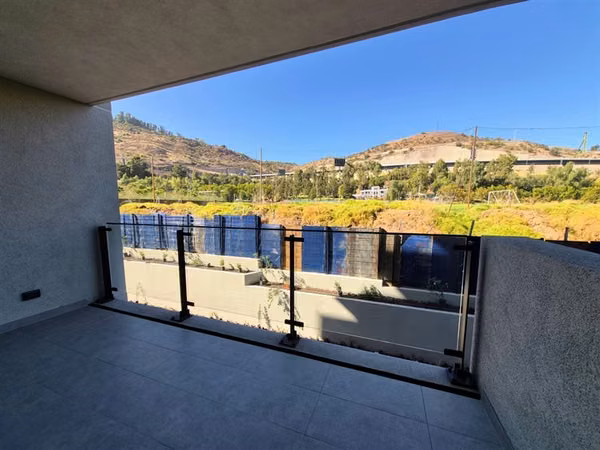 Departamento en venta de 2 dorm. con jardín en Huechuraba
