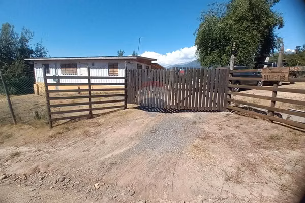 Parcela con casa en puente negro