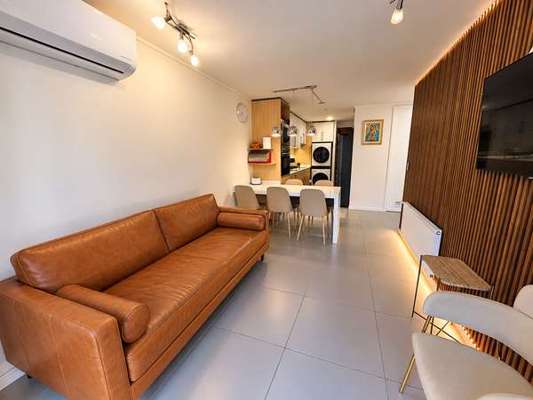 DEPARTAMENTO CON PATIO LOMEJOR DE ÑUÑOA  CON ESTACIONAMIENTO