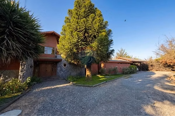 Parcela en isla de maipo estilo montañés