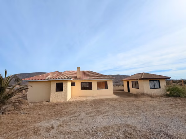 Parcela en  Meseta  de Quitallaco con Casa / Ruta 43