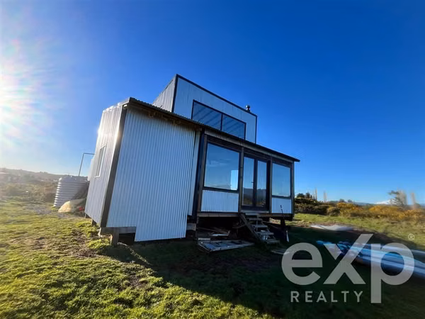 Parcela con casa en venta en Puerto Montt con salida a rio.