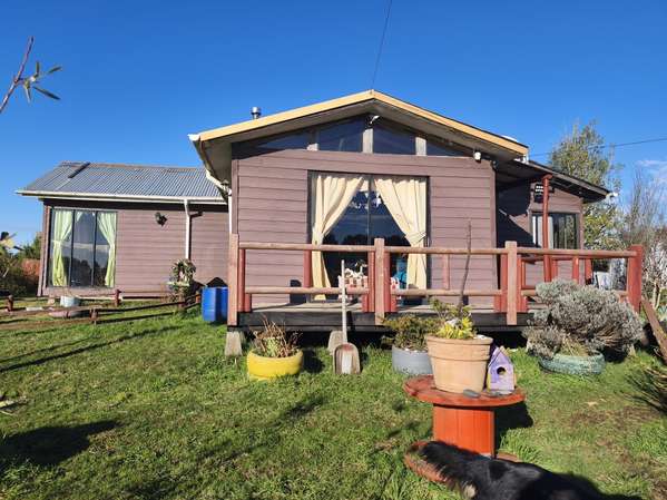 Parcela con casa + 01 cabaña con tinaja en Puerto Montt.