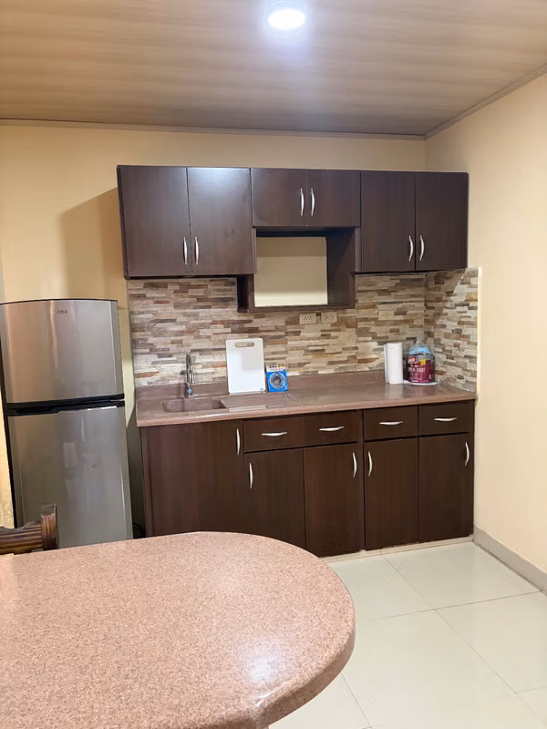 ONE BEDROOM FURNISHED STUDIO APARTMENT WITH REFRIGERATOR, BREAKFAST, BED AND WASHING MACHINE