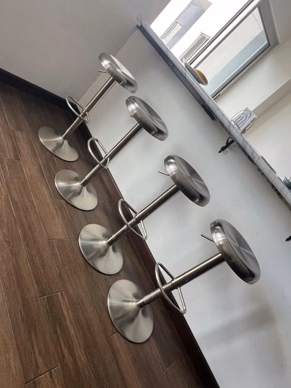 Set of 4 adjustable stainless steel benches for breakfast / bar