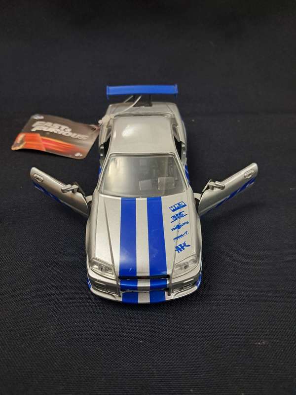 Juguete de rápidos y furiosos nissan skyline GT-R R34 escala 1/32