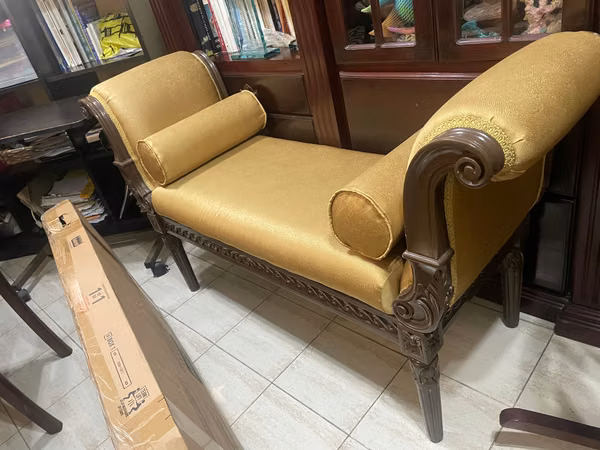 Finely upholstered and elegant bank for a living room