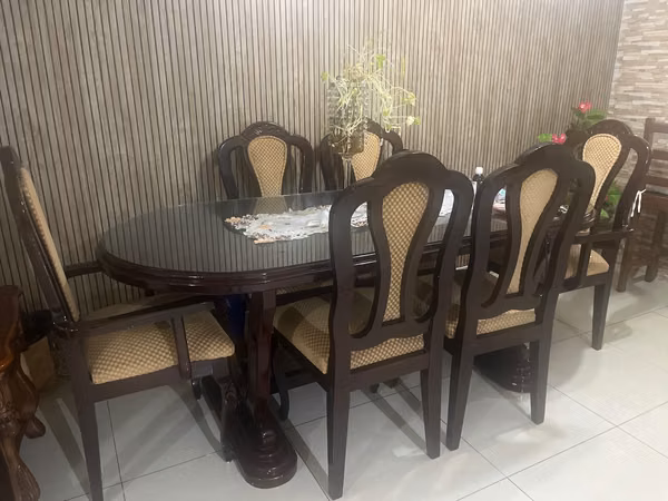 Wooden dining room with protective glass