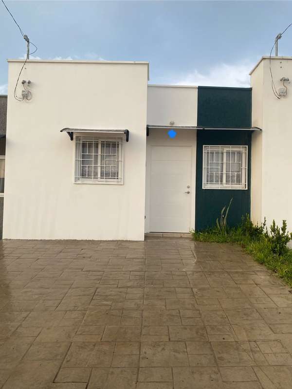 There's a house in the middle of the city. San Juan Opico