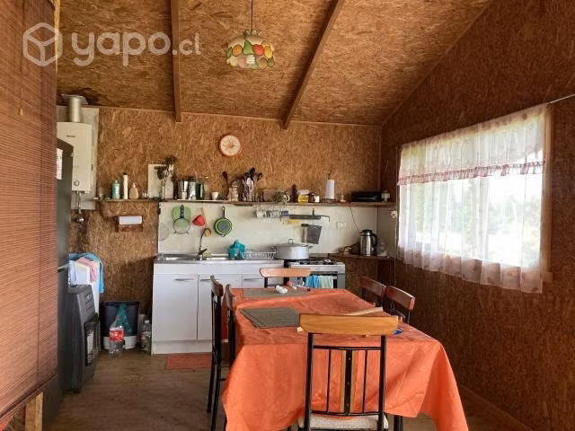 Se vende terreno con cabaña