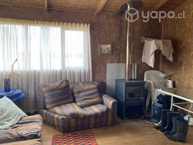 Se vende terreno con cabaña