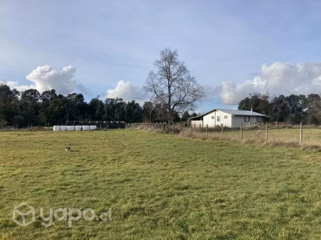 Se vende terreno con cabaña