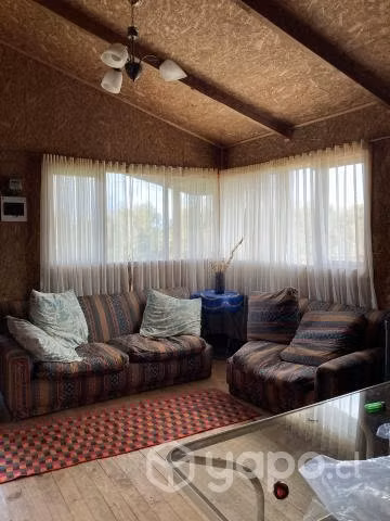 Se vende terreno con cabaña