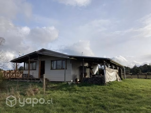 Se vende terreno con cabaña