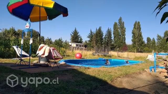 Parcela con casa y piscina