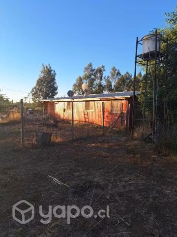 Parcela con casa habitación