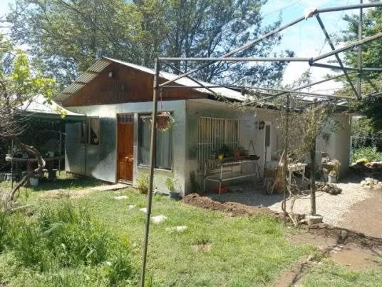 Vendo terreno con casa