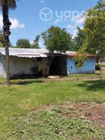 Terreno con casa habitación