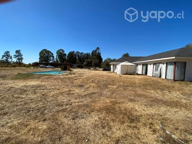 Parcela con casa y piscina en condimio vende dueño