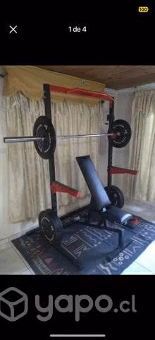 Half rack con barra olímpica y 60 kilos de goma