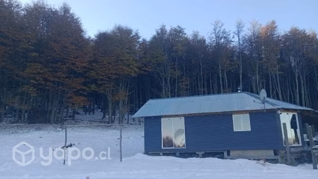 Vendo parcela de 1/2 hectárea con casa y cabaña