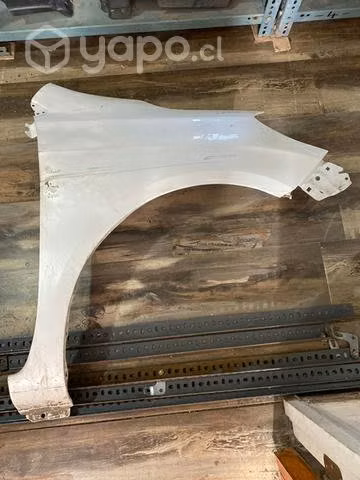 Tapabarro Nissan versa lado copiloto blanco