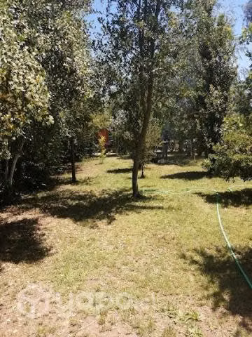 Terreno con casa, cabañas y piscinas