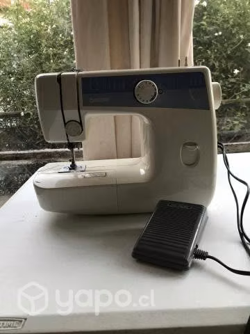 Maquina de coser marca janome