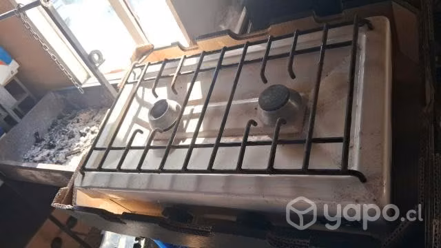 Parrilla usada le falta un quemador