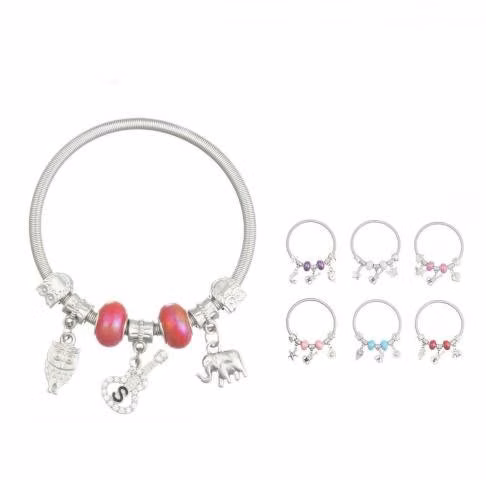 Pulsera de plata con dije de guitarra y búho