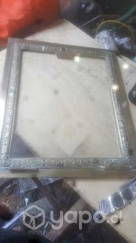 Estufa y marco de bronce