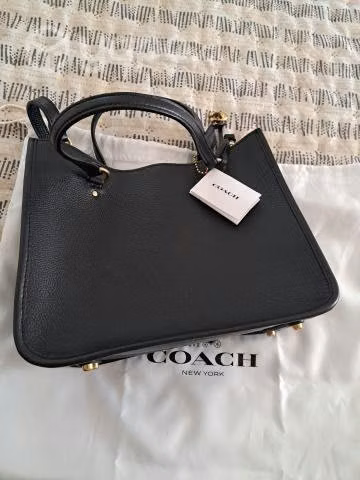 Cartera Coach Nueva sin uso 100% cuero