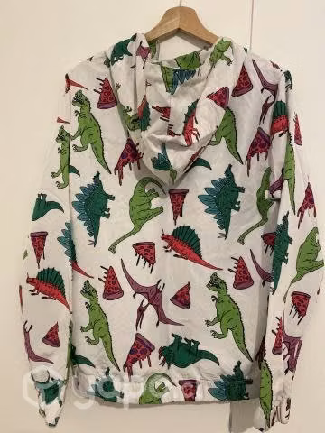Chaqueta corta viento dinosaurio