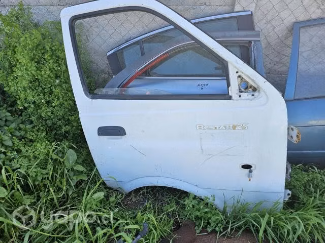 Puerta delantera kia besta 2006