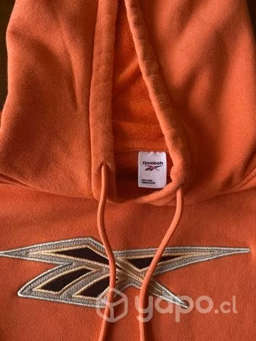 Poleron naranjo reebok