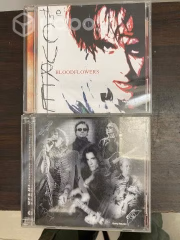 Cd de the cure y aerosmith