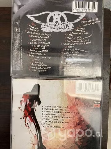 Cd de the cure y aerosmith