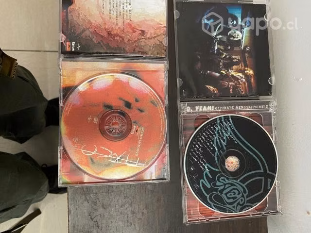 Cd de the cure y aerosmith