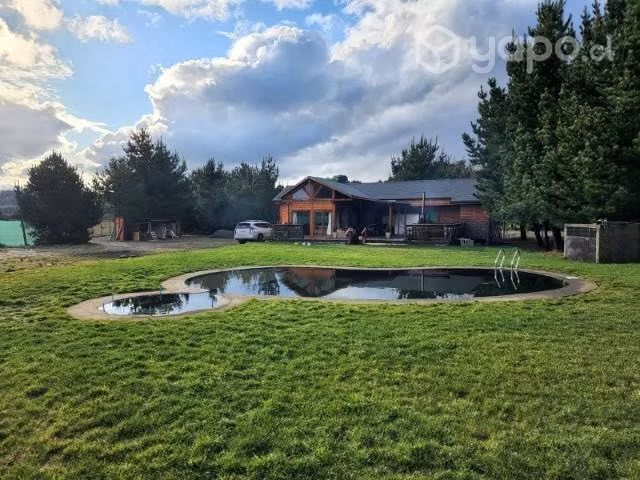 Parcela con casa a orilla de río tolten