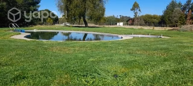 Parcela con casa a orilla de río tolten