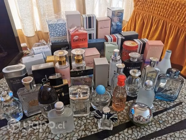 36 frascos de perfumes vacios