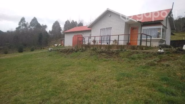 Parcela con casa