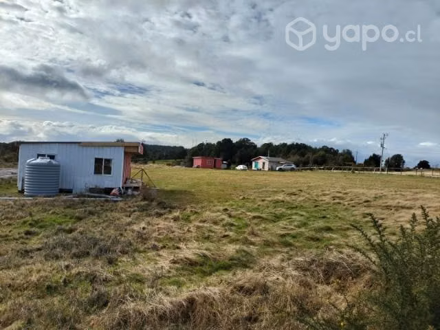 Parcela con casas
