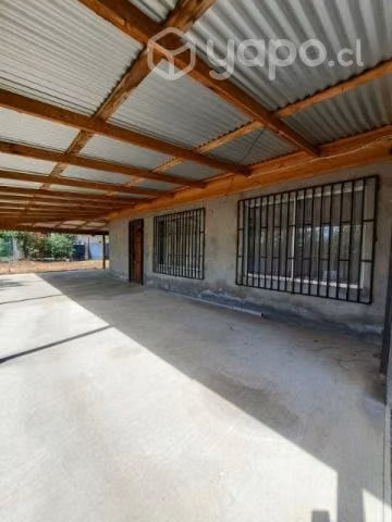 parcela con casa material