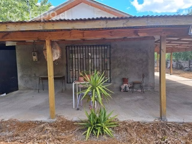 parcela con casa material