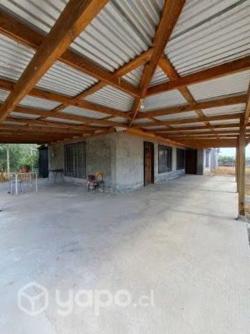 parcela con casa material