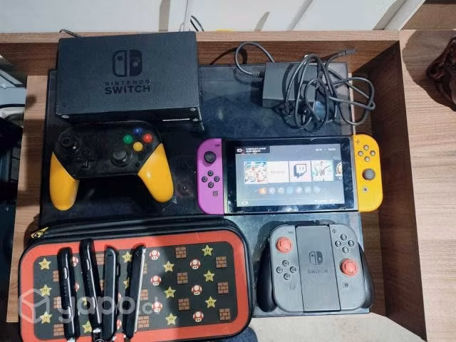 Nintendo switch + 4 joycons + control pro + juegos