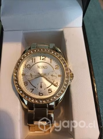 Reloj dorado xoxo