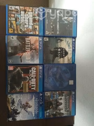 ps4 a 350.000 con 2 mandos y 8 juegos